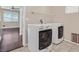 Well-lit laundry room with tile flooring, window, shelving, and modern white washer and dryer at 2864 Kinknockie Way, Henderson, NV 89044