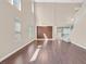 Bright living room features wood floors, high ceilings, large windows and an open staircase at 2864 Kinknockie Way, Henderson, NV 89044