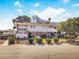 Inviting condominium with well-maintained landscaping, mature trees, and a view of the Westgate hotel in the background at 2867 Geary Pl # 3008, Las Vegas, NV 89109