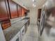Functional kitchen features granite countertops and stainless-steel appliances plus in-unit laundry at 2867 Geary Pl # 3008, Las Vegas, NV 89109