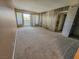 Expansive living room filled with natural light from the sliding glass door leading to the balcony at 2867 Geary Pl # 3008, Las Vegas, NV 89109