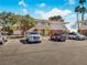 Exterior view showing parking area with several vehicles parked at the condominium complex at 2867 Geary Pl # 3008, Las Vegas, NV 89109