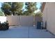 Enclosed backyard with chain-link fence, patio, and external AC unit at 30 Diamond Bar Rd, Pahrump, NV 89048