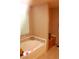 Relaxing bathroom with tub, tiled surround and window at 30 Diamond Bar Rd, Pahrump, NV 89048