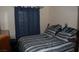 Bedroom with window and striped bedding at 30 Diamond Bar Rd, Pahrump, NV 89048
