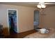 Relaxing bedroom with natural light, featuring wood-look flooring and a walk-in closet at 30 Diamond Bar Rd, Pahrump, NV 89048