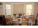 Bright dining area with bay window and seating for four, creating a cozy ambiance at 30 Diamond Bar Rd, Pahrump, NV 89048