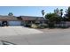 Charming single-story home featuring a well-manicured front yard and a spacious driveway at 30 Diamond Bar Rd, Pahrump, NV 89048