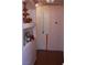 Hallway with built-in shelves and storage, accented by warm, neutral wall colors at 30 Diamond Bar Rd, Pahrump, NV 89048