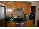 Updated kitchen with stainless steel appliances and granite countertops, offering style and functionality at 30 Diamond Bar Rd, Pahrump, NV 89048