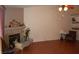 Comfortable living room with fireplace, wood-look floors, and plenty of room for decor at 30 Diamond Bar Rd, Pahrump, NV 89048