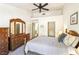 Bedroom with high ceilings, ceiling fan, matching dressers, and a full size bed at 3013 Sungold Dr, Las Vegas, NV 89134