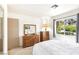 Bedroom with carpet, a window, and a door to a mirrored closet at 3013 Sungold Dr, Las Vegas, NV 89134