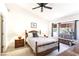 Comfortable bedroom with a decorative bed, matching nightstands and a window seat at 3013 Sungold Dr, Las Vegas, NV 89134