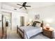 Cozy bedroom featuring a ceiling fan, carpet, and a view of other rooms at 3013 Sungold Dr, Las Vegas, NV 89134
