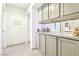 Hallway with tile flooring and built-in cabinets, offering ample storage space at 3013 Sungold Dr, Las Vegas, NV 89134