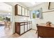 Functional kitchen with white cabinetry, natural light, and a view into the dining area at 3013 Sungold Dr, Las Vegas, NV 89134