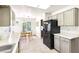 Bright kitchen features white countertops, a stainless steel sink, and black appliances at 3013 Sungold Dr, Las Vegas, NV 89134