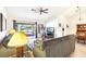 Bright living room features neutral tones, patio access, and a ceiling fan at 3013 Sungold Dr, Las Vegas, NV 89134