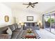 Cozy living room with ample seating, neutral color palette, and patio access at 3013 Sungold Dr, Las Vegas, NV 89134
