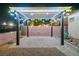 An expansive backyard with a brick patio and decorative pergola create a luxurious outdoor living space at 3096 Beaux Art Ave, Henderson, NV 89044