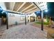 Backyard patio with desert landscaping, pavers, and lighted pergola at 3096 Beaux Art Ave, Henderson, NV 89044