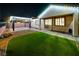 Outdoor space at night with patio, landscaping, and exterior lighting at 3096 Beaux Art Ave, Henderson, NV 89044