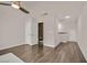 Bright, airy bedroom featuring wood-look floors and an ensuite bathroom at 3096 Beaux Art Ave, Henderson, NV 89044