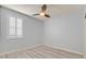 Bedroom featuring shuttered windows, ceiling fan, light hardwood floors, and neutral colored walls at 3096 Beaux Art Ave, Henderson, NV 89044