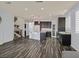 Open layout showcasing the kitchen with an island, breakfast bar, and modern appliances at 3096 Beaux Art Ave, Henderson, NV 89044