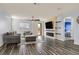 Comfortable living room with ceiling fan, fireplace, TV, and outdoor access at 3096 Beaux Art Ave, Henderson, NV 89044