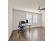 Bright office space with ample natural light from shuttered windows and wood look flooring at 3096 Beaux Art Ave, Henderson, NV 89044