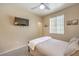 Calm bedroom featuring modern decor, neutral tones, a mounted TV, and an open doorway at 344 Golden Shore Dr, Las Vegas, NV 89123