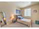 Tranquil bedroom with natural light, ceiling fan, neutral decor, and comfortable furnishings at 344 Golden Shore Dr, Las Vegas, NV 89123