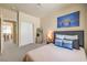 Well-lit bedroom with modern decor, comfortable bed, and a relaxing atmosphere perfect for unwinding at 344 Golden Shore Dr, Las Vegas, NV 89123