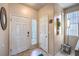 Inviting entryway with neutral tones, tiled flooring, and decorative accents with natural light at 344 Golden Shore Dr, Las Vegas, NV 89123