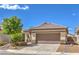 Charming single-story home featuring a well-maintained front yard and a two-car garage at 344 Golden Shore Dr, Las Vegas, NV 89123