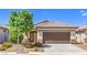 Well-maintained single-story home featuring desert landscaping and a convenient two-car garage at 344 Golden Shore Dr, Las Vegas, NV 89123