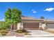 Charming single-story home featuring a well-maintained front yard, covered entry, and a two-car garage at 344 Golden Shore Dr, Las Vegas, NV 89123