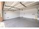 Spacious garage with epoxy flooring and ample storage space, perfect for car enthusiasts or hobbyists at 344 Golden Shore Dr, Las Vegas, NV 89123