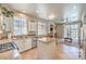Bright kitchen with granite countertops and island overlooking the living area and backyard pool at 344 Golden Shore Dr, Las Vegas, NV 89123