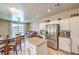 Open kitchen with granite countertops, stainless steel appliances, and a seamless transition to the living area at 344 Golden Shore Dr, Las Vegas, NV 89123