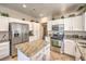 Bright kitchen featuring stainless steel appliances, granite countertops, and ample cabinet space at 344 Golden Shore Dr, Las Vegas, NV 89123