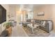 Cozy living room featuring a comfortable sectional sofa, modern decor, and plenty of natural light at 344 Golden Shore Dr, Las Vegas, NV 89123