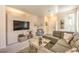 Inviting living room with a large sectional, contemporary decor, and a relaxing ambiance at 344 Golden Shore Dr, Las Vegas, NV 89123