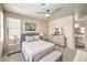 Serene primary bedroom with neutral tones, carpeted floors, and an attached bathroom at 344 Golden Shore Dr, Las Vegas, NV 89123