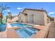 Backyard featuring a refreshing pool and spa, ideal for outdoor relaxation and entertaining in a private setting at 344 Golden Shore Dr, Las Vegas, NV 89123