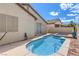 Backyard pool with spa, perfect for cooling off on warm days, surrounded by landscaping and desert views at 344 Golden Shore Dr, Las Vegas, NV 89123