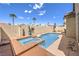 Inviting backyard oasis with a sparkling pool and spa surrounded by lush landscaping and ample lounging space at 344 Golden Shore Dr, Las Vegas, NV 89123