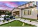 Charming backyard featuring artificial turf, putting green, patio area, and serene outdoor living space at 3929 Reyes Ave, Las Vegas, NV 89141